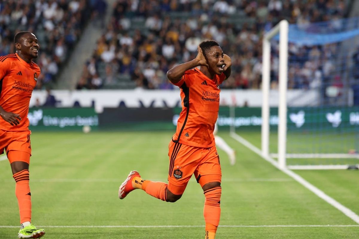 May 25, 2024; Carson, California, USA; Houston Dynamo FC midfielder Latif Blessing (15) celebrates after scoring a goal against the LA Galaxy in the first half at Dignity Health Sports Park. Mandatory Credit: Kiyoshi Mio-USA TODAY Sports