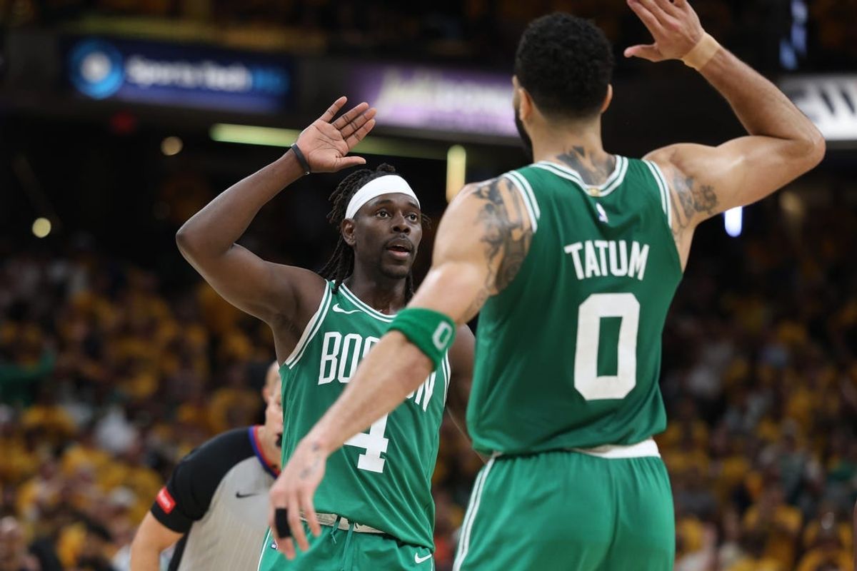 May 25, 2024; Indianapolis, Indiana, USA; Boston Celtics guard Jrue Holiday (4) celebrates with forward Jayson Tatum (0) after drawing a foul against the Indiana Pacers in the closing seconds of the fourth quarter of game three of the eastern conference finals in the 2024 NBA playoffs at Gainbridge Fieldhouse. Mandatory Credit: Trevor Ruszkowski-USA TODAY Sports
