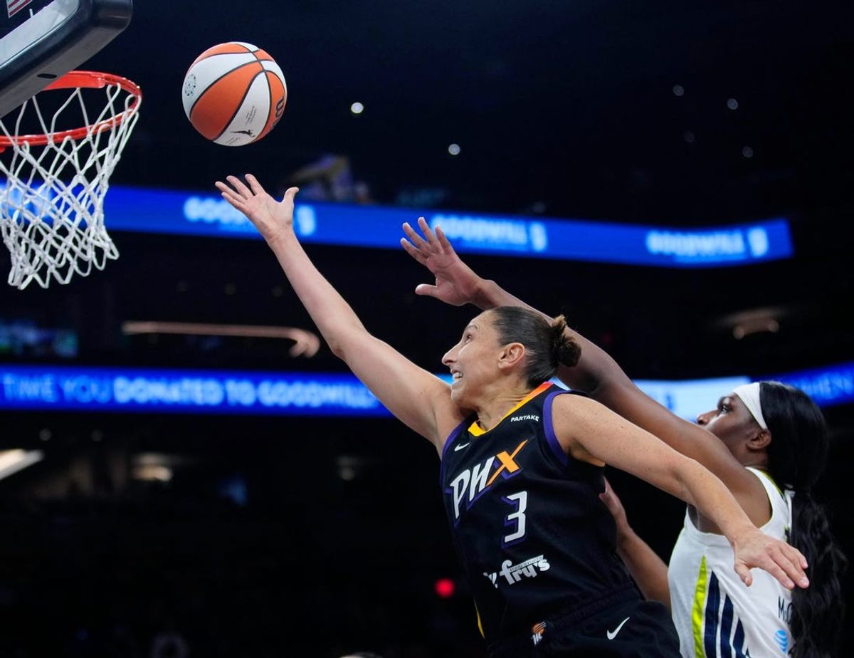 Mercury guard Diana Taurasi (3) makes a layup past Wings center Teaira McCowan (15) during a game at the Footprint Center in Phoenix on Saturday, May 25, 2024.