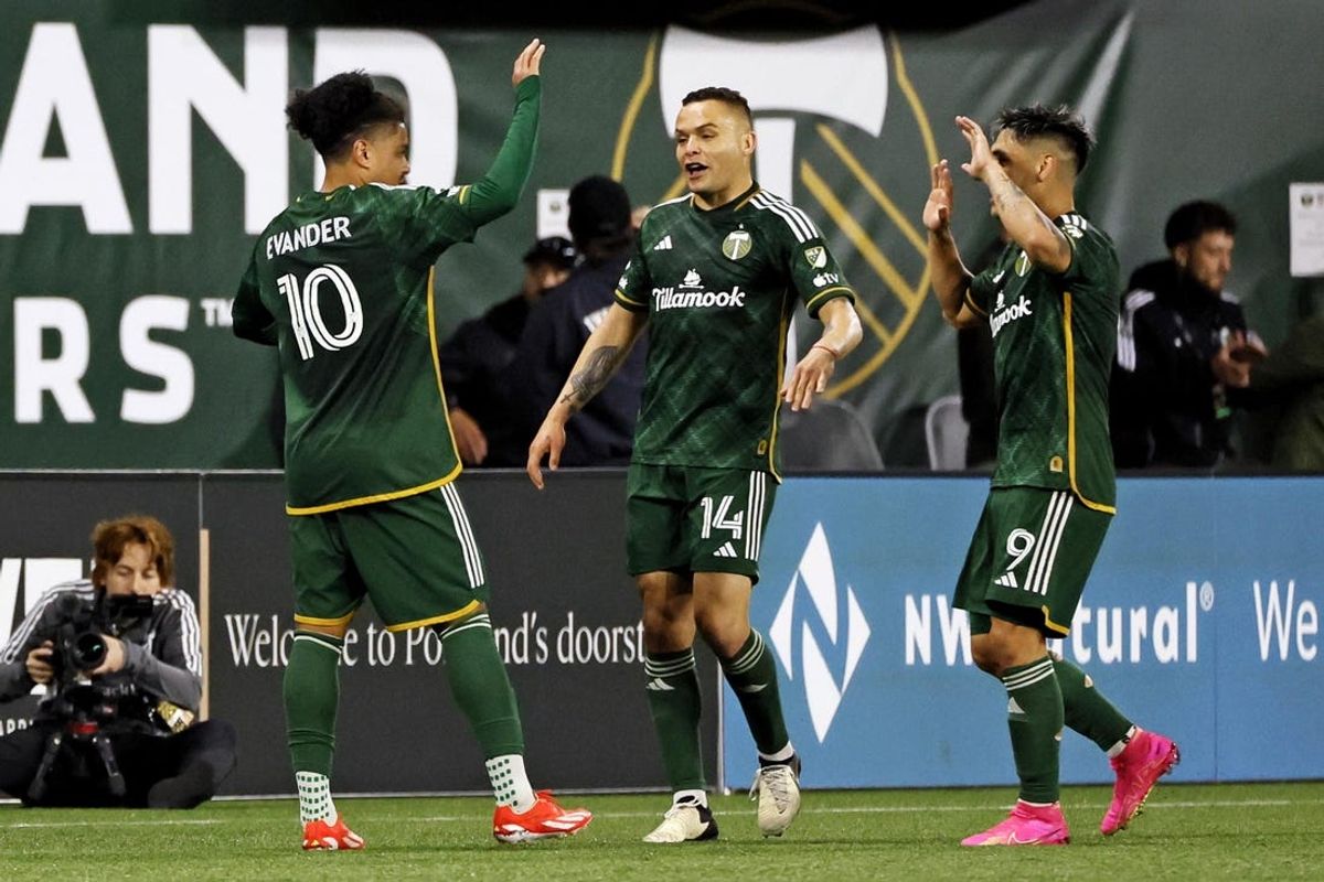 May 25, 2024; Portland, Oregon, USA; Portland Timbers midfielder Evander (10) celebrates with forward Jonathan Rodriguez (14) after scoring a goal during the second half against Sporting Kansas City at Providence Park. Mandatory Credit: Soobum Im-USA TODAY Sports