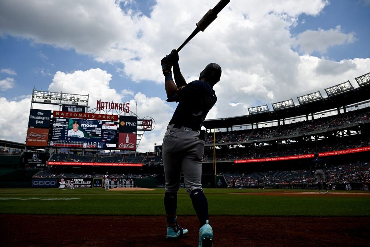 May 26, 2024; Washington, District of Columbia, USA; Seattle Mariners center fielder Julio Rodriguez (44) takes a practice swing on the on deck circle against the Washington Nationals during the first inning at Nationals Park. Mandatory Credit: Rafael Suanes-USA TODAY Sports