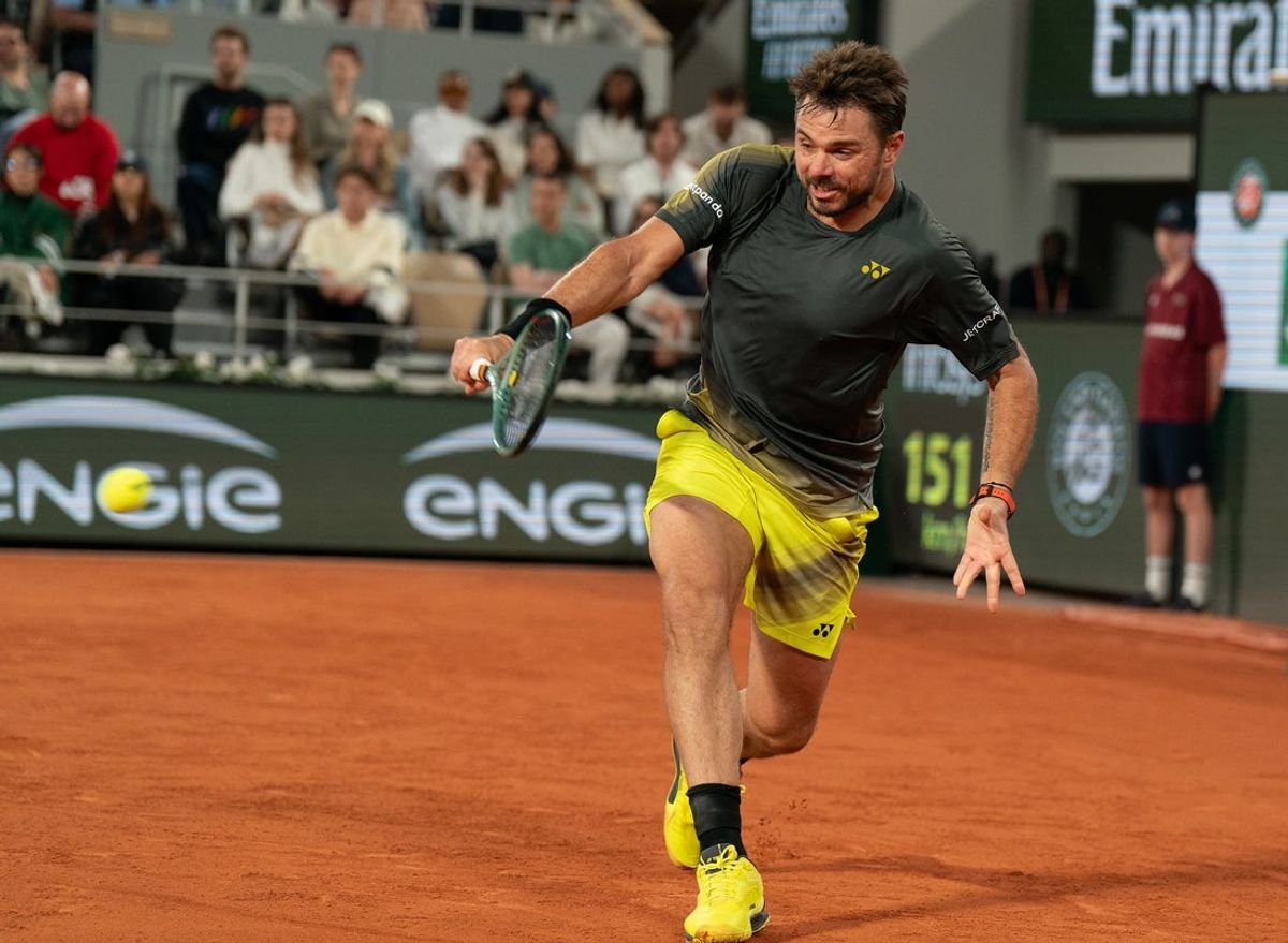 May 26, 2024; Paris, France; Stan Wawrinka of Switzerland returns a shot during his match against Andy Murray of Great Britain on day one of Roland Garros at Stade Roland Garros. Mandatory Credit: Susan Mullane-Imagn Images