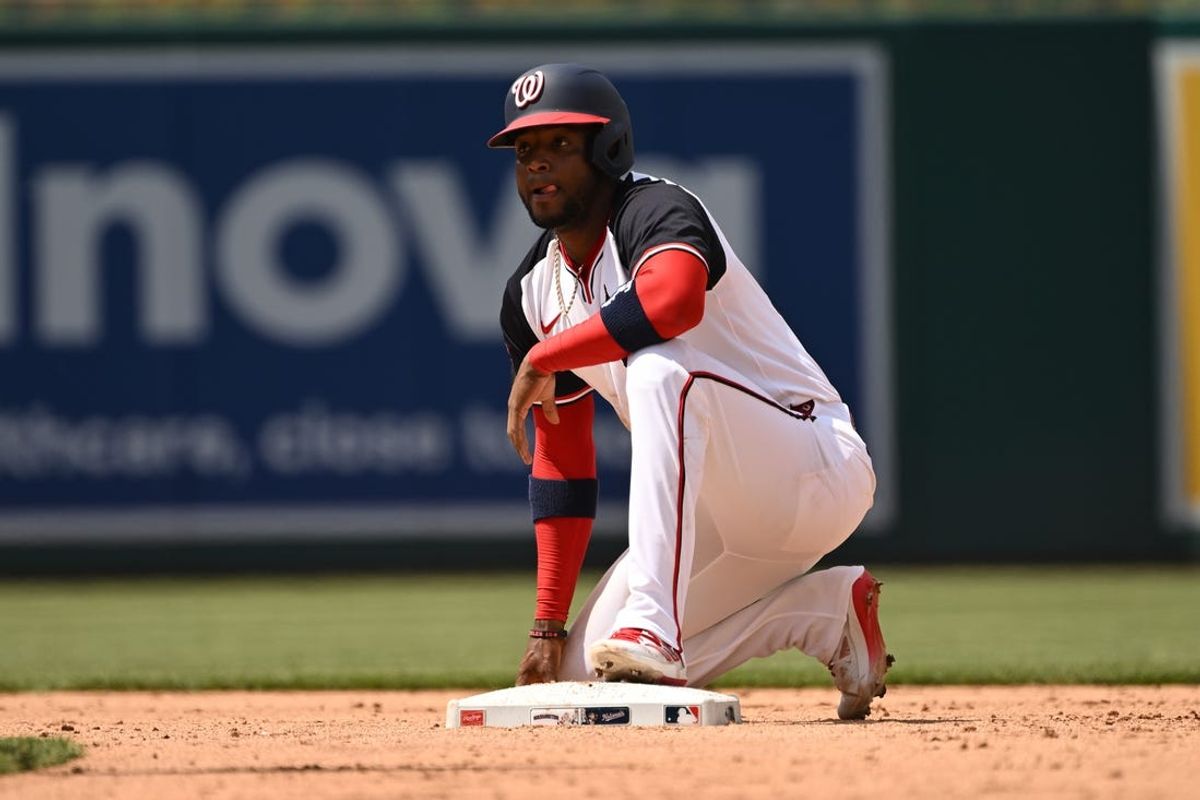 May 26, 2024; Washington, District of Columbia, USA; Washington Nationals center fielder Victor Robles rests on the bag after stealing second base against the Seattle Mariners during the sixth inning at Nationals Park. Mandatory Credit: Rafael Suanes-USA TODAY Sports