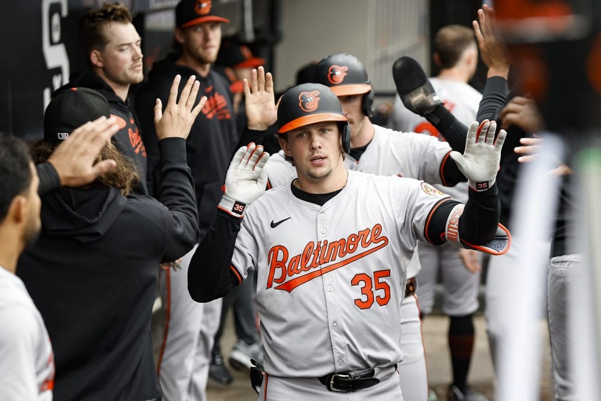 May 26, 2024; Chicago, Illinois, USA; Baltimore Orioles catcher Adley Rutschman (35) celebrates with teammates after hitting a two-run home run against the Chicago White Sox during the sixth inning at Guaranteed Rate Field. Mandatory Credit: Kamil Krzaczynski-USA TODAY Sports