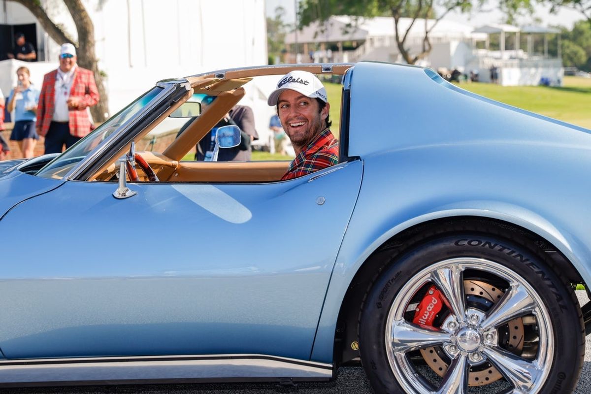 May 26, 2024; Fort Worth, Texas, USA; Davis Riley sits inside the winner’s  1975 Stingray Corvette after the final round of the Charles Schwab Challenge golf tournament. Mandatory Credit: Andrew Dieb-Imagn Images