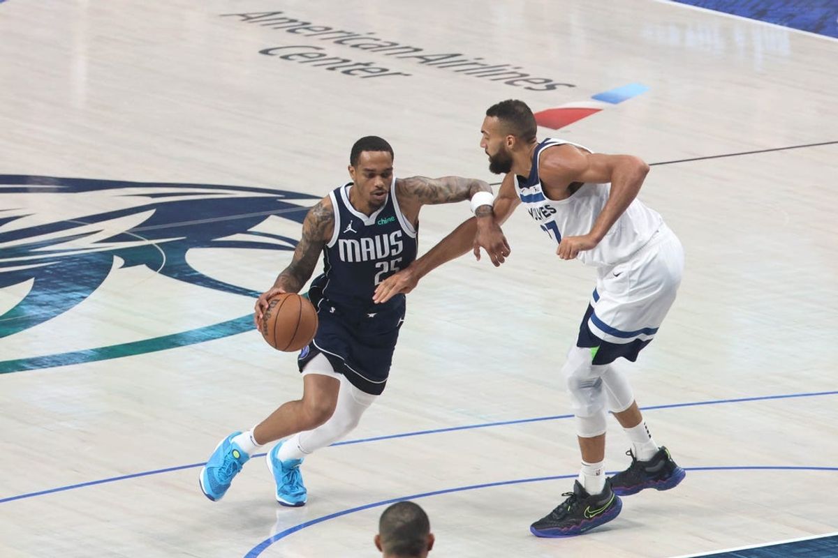 May 26, 2024; Dallas, Texas, USA; Dallas Mavericks forward P.J. Washington (25) controls the ball against Minnesota Timberwolves center Rudy Gobert (27) in the first quarter during game three of the western conference finals for the 2024 NBA playoffs at American Airlines Center. Mandatory Credit: Kevin Jairaj-USA TODAY Sports