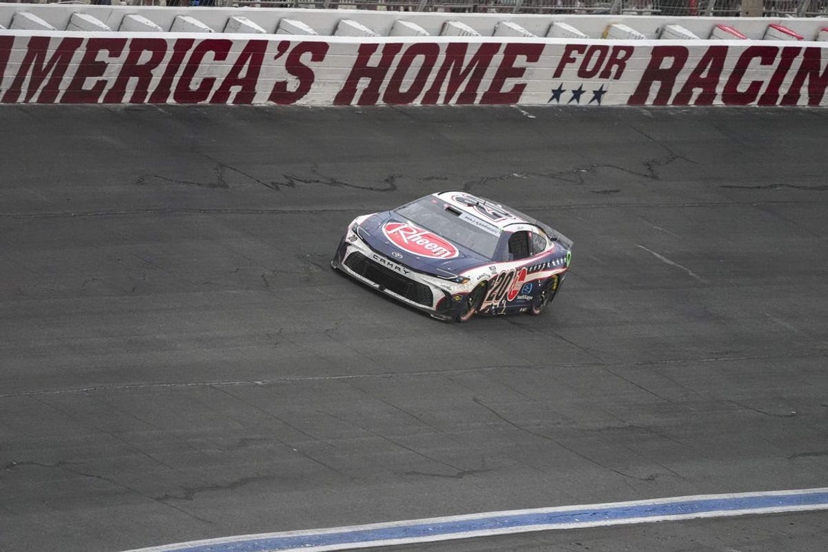 May 26, 2024; Concord, North Carolina, USA; NASCAR Cup Series driver Christopher Bell (20) leads in turn four at Charlotte Motor Speedway. Mandatory Credit: Jim Dedmon-USA TODAY Sports