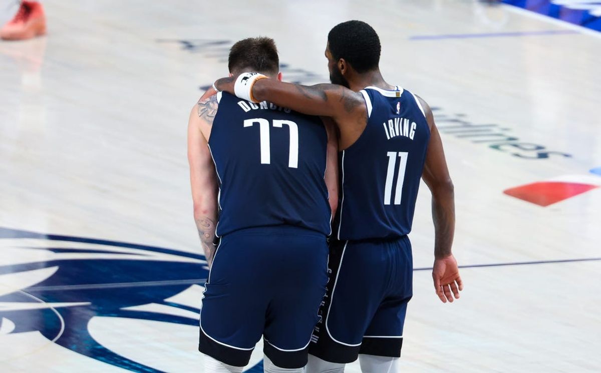 May 26, 2024; Dallas, Texas, USA; Dallas Mavericks guard Luka Doncic (77) and Dallas Mavericks guard Kyrie Irving (11) hug during the fourth quarter against the Minnesota Timberwolves during game three of the western conference finals for the 2024 NBA playoffs at American Airlines Center. Mandatory Credit: Kevin Jairaj-USA TODAY Sports