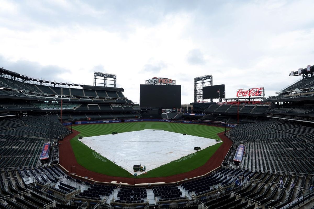 May 27, 2024; New York City, New York, USA; General view of Citi Field with the tarp on the field after a game between the New York Mets and the Los Angeles Dodgers was postponed due to inclement weather. Mandatory Credit: Brad Penner-USA TODAY Sports
