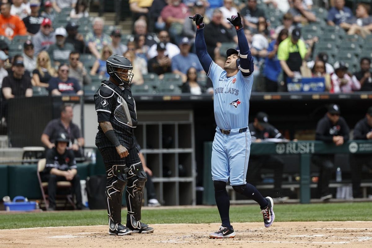 May 27, 2024; Chicago, Illinois, USA; Toronto Blue Jays outfielder George Springer (4) crosses home plate after hitting a two-run home run against the Chicago White Sox during the second inning at Guaranteed Rate Field. Mandatory Credit: Kamil Krzaczynski-USA TODAY Sports
