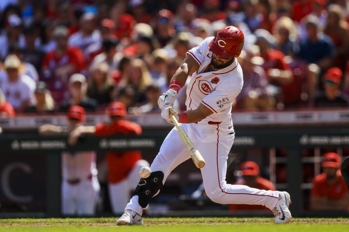 May 27, 2024; Cincinnati, Ohio, USA; Cincinnati Reds designated hitter Nick Martini (23) hits a single against the St. Louis Cardinals in the second inning at Great American Ball Park. Mandatory Credit: Katie Stratman-USA TODAY Sports
