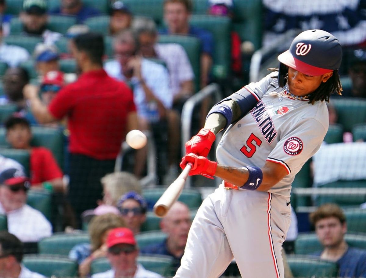 May 27, 2024; Cumberland, Georgia, USA; Washington Nationals shortstop CJ Abrams (5) hits a solo home against the Atlanta Braves during the second inning at Truist Park. Mandatory Credit: John David Mercer-USA TODAY Sports