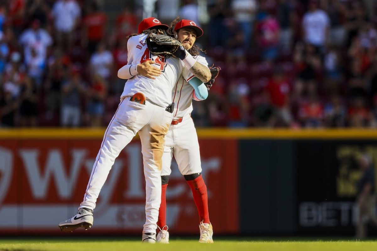 May 27, 2024; Cincinnati, Ohio, USA; Cincinnati Reds shortstop Elly De La Cruz (44) hugs second baseman Jonathan India (6) after the victory over the St. Louis Cardinals at Great American Ball Park. Mandatory Credit: Katie Stratman-USA TODAY Sports