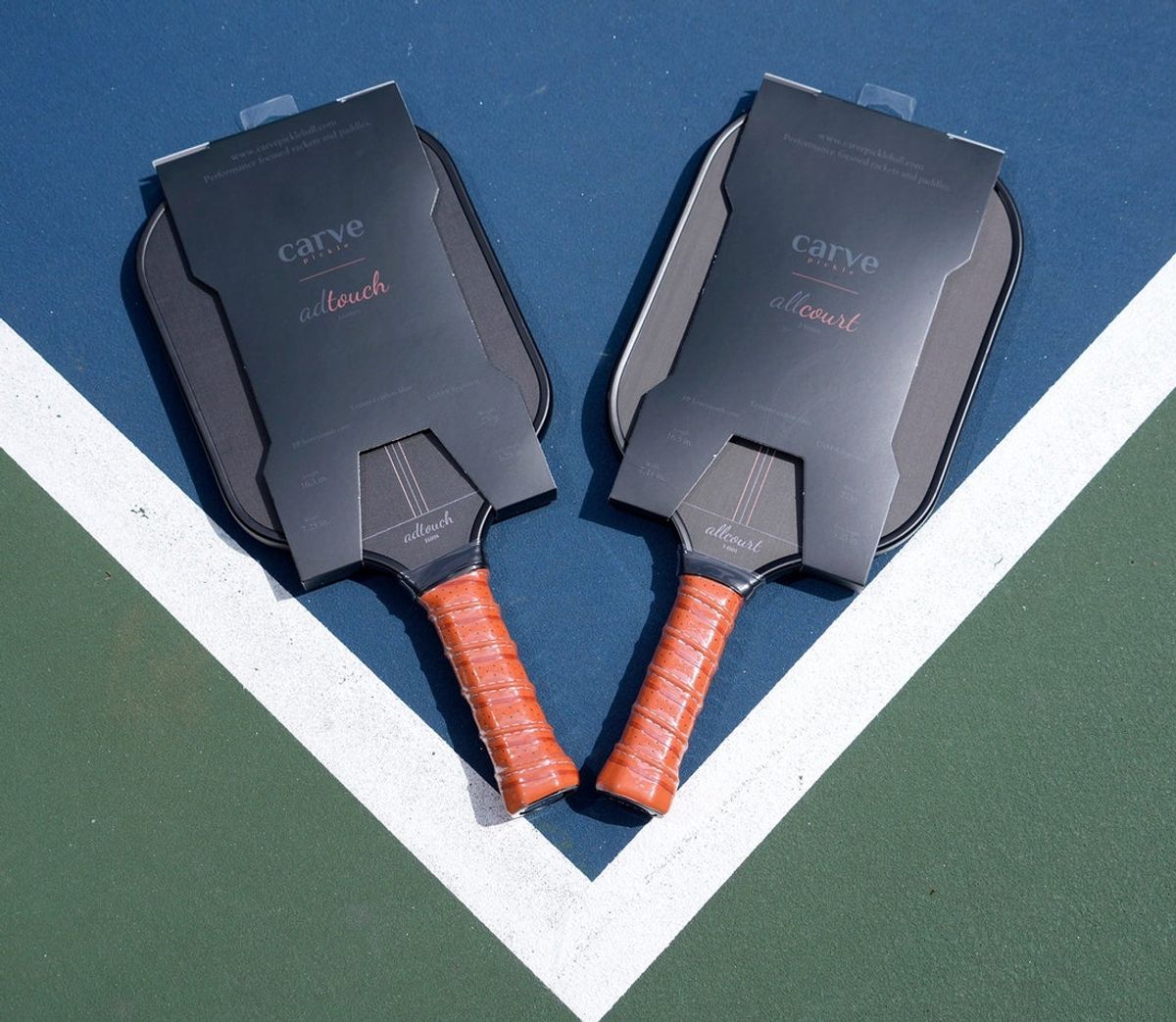 A couple of the Pickleball paddles Nick Aho has developed, the Carve AdTouch (left) and the Carve AllCourt, at Buchner Park on Oakland Avenue in Waukesha on Tuesday, May 28, 2024. Aho’s startup business, Carve Sports, makes Pickleball paddles and tennis rackets, that sells direct to consumers rather than through sporting goods stores.
