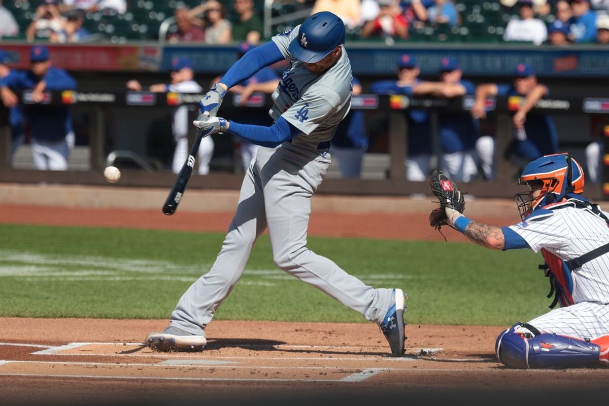 May 28, 2024; New York, NY, USA;  Los Angeles Dodgers first baseman Freddie Freeman (5) singles during the first inning against the New York Mets at Citi Field. Mandatory Credit: Vincent Carchietta-USA TODAY Sports