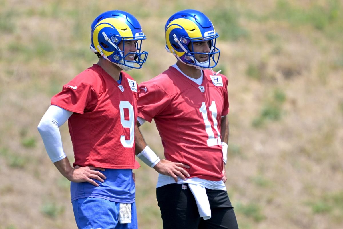May 28, 2024; Thousand Oaks, CA, USA; Los Angeles Rams quarterbacks Matthew Stafford (9) and Jimmy Garoppolo (11) look on during OTAs at the team training facility at California Lutheran University. Mandatory Credit: Jayne Kamin-Oncea-Imagn Images