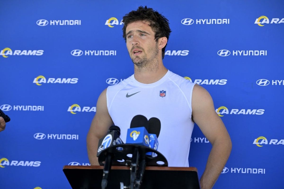 May 28, 2024; Thousand Oaks, CA, USA; Los Angeles Rams quarterback Stetson Bennett (13) speaks to the media following OTAs at the team training facility at California Lutheran University. Mandatory Credit: Jayne Kamin-Oncea-USA TODAY Sports