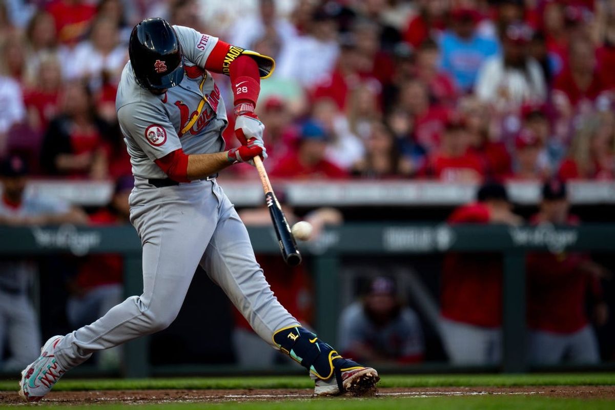 St. Louis Cardinals third baseman Nolan Arenado (28) hits a 2-run home run in the fourth inning of the MLB baseball game between the Cincinnati Reds and the St. Louis Cardinals at Great American Ball Park in Cincinnati on Tuesday, May 28, 2024.