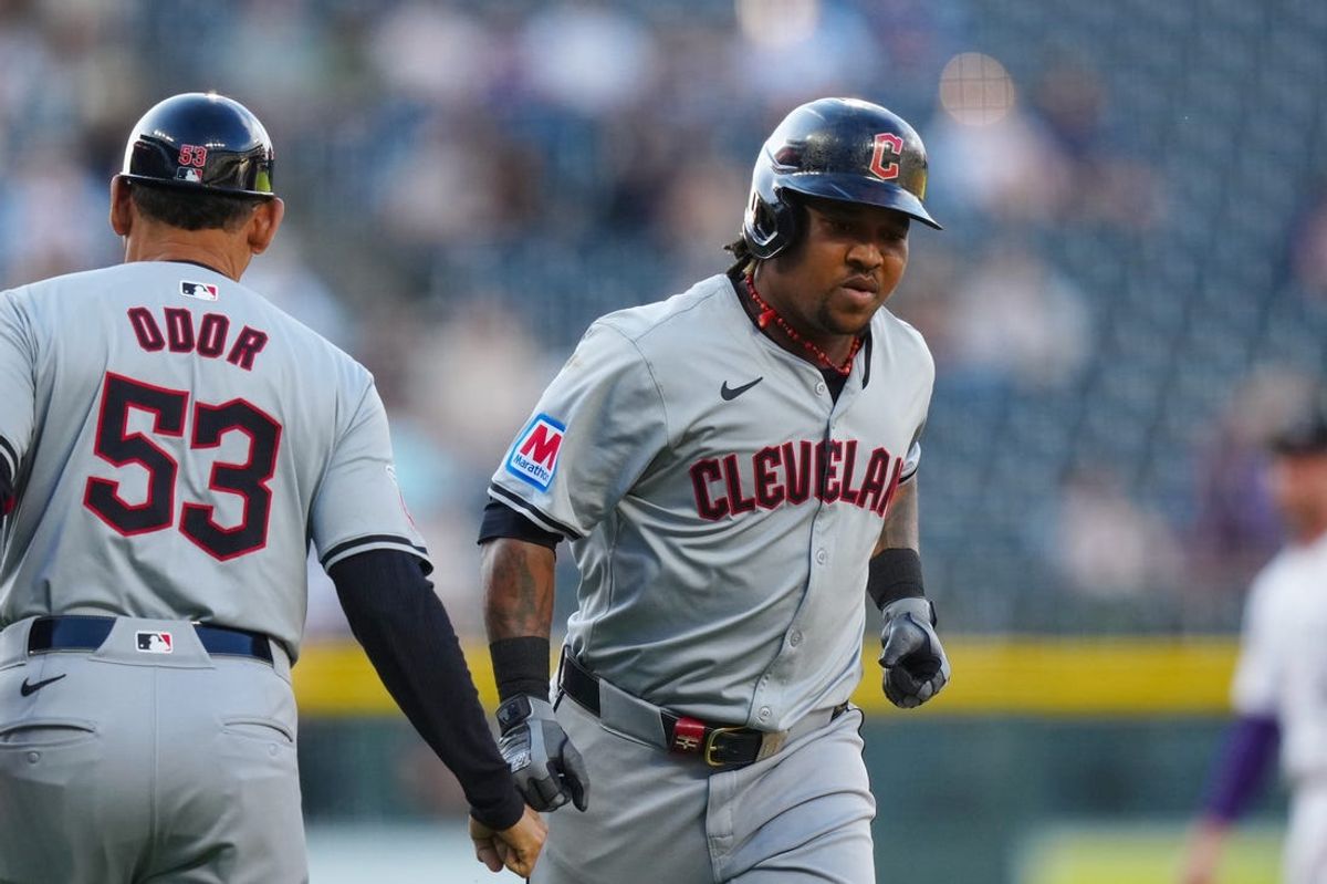 May 28, 2024; Denver, Colorado, USA; Cleveland Guardians third base José Ramírez (11) is congratulated for his two run home run by third base coach Rouglas Odor (53) in the first inning against the Colorado Rockies at Coors Field. Mandatory Credit: Ron Chenoy-USA TODAY Sports