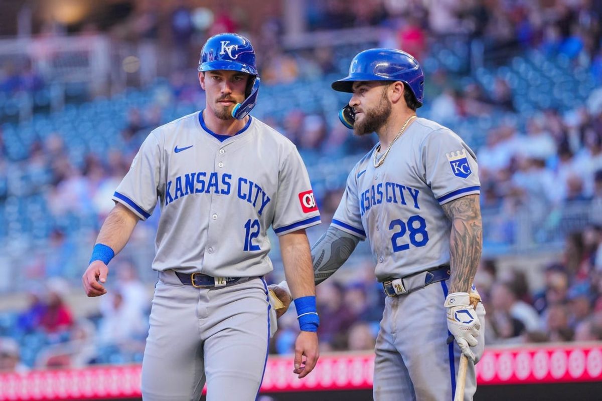 May 28, 2024; Minneapolis, Minnesota, USA; Kansas City Royals outfielder Kyle Isbel (28) congratulates second base Nick Loftin (12) against the Minnesota Twins in the fifth inning at Target Field. Mandatory Credit: Brad Rempel-USA TODAY Sports