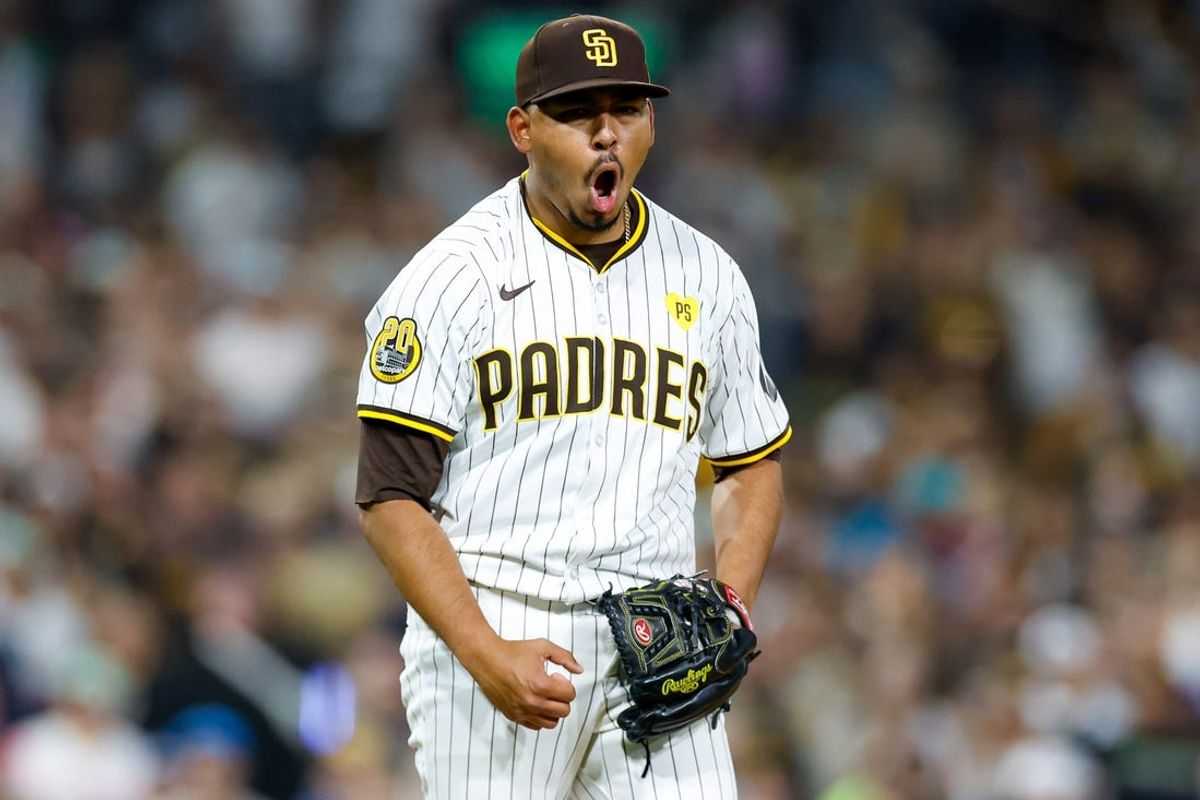 May 28, 2024; San Diego, California, USA; San Diego Padres relief pitcher Jeremiah Estrada (56) celebrates after striking out the side in the ninth inning against the Miami Marlins at Petco Park. Mandatory Credit: David Frerker-USA TODAY Sports