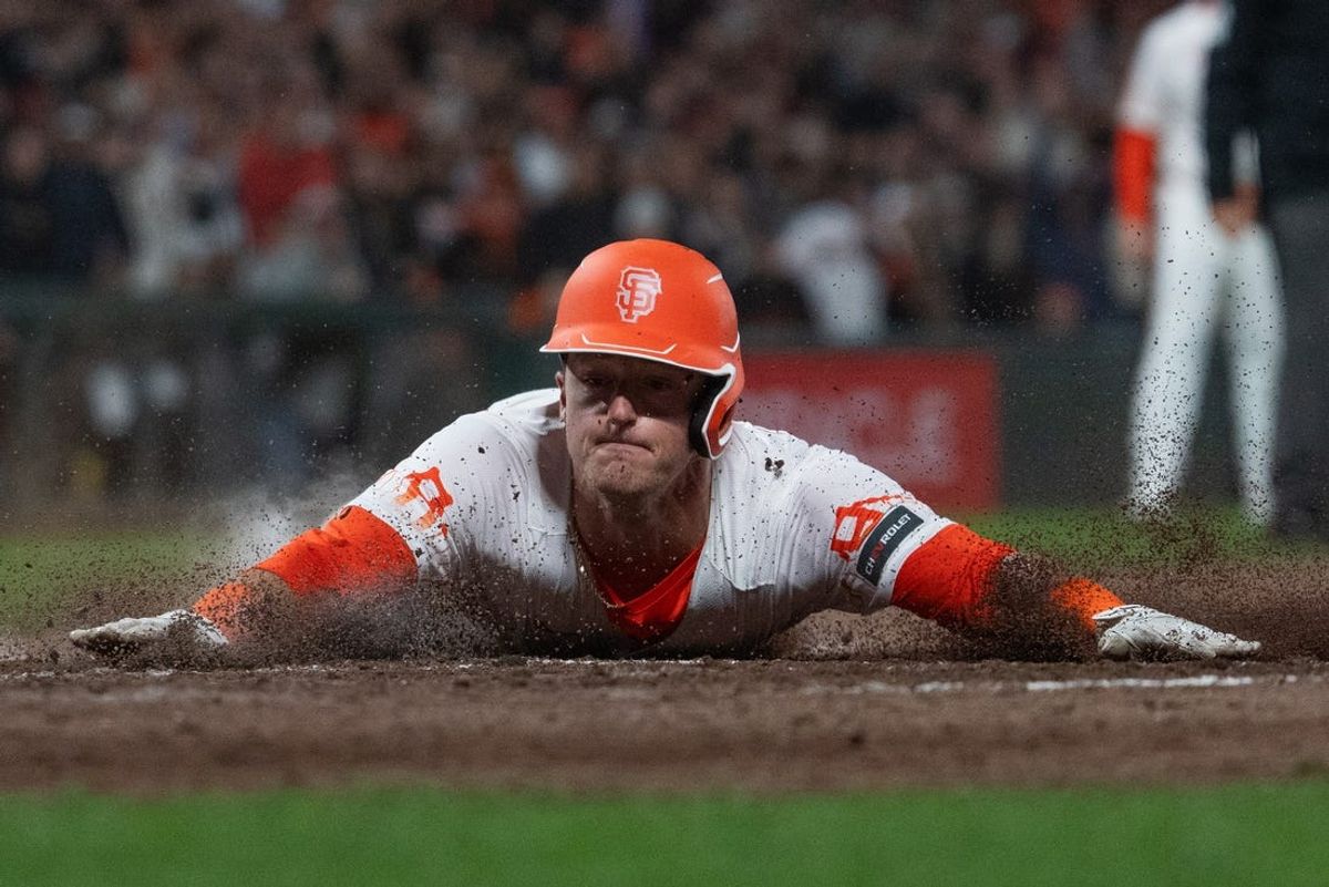 May 28, 2024; San Francisco, California, USA;  San Francisco Giants shortstop Tyler Fitzgerald (49) slides into home plate to defeat the Philadelphia Phillies at Oracle Park. Mandatory Credit: Stan Szeto-USA TODAY Sports