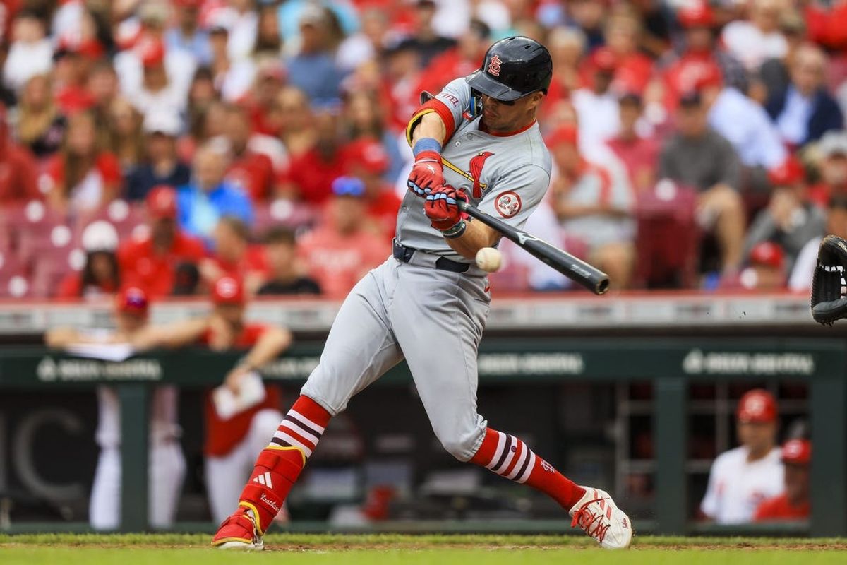 May 29, 2024; Cincinnati, Ohio, USA; St. Louis Cardinals outfielder Lars Nootbaar (21) hits a single against the Cincinnati Reds in the third inning at Great American Ball Park. Mandatory Credit: Katie Stratman-USA TODAY Sports