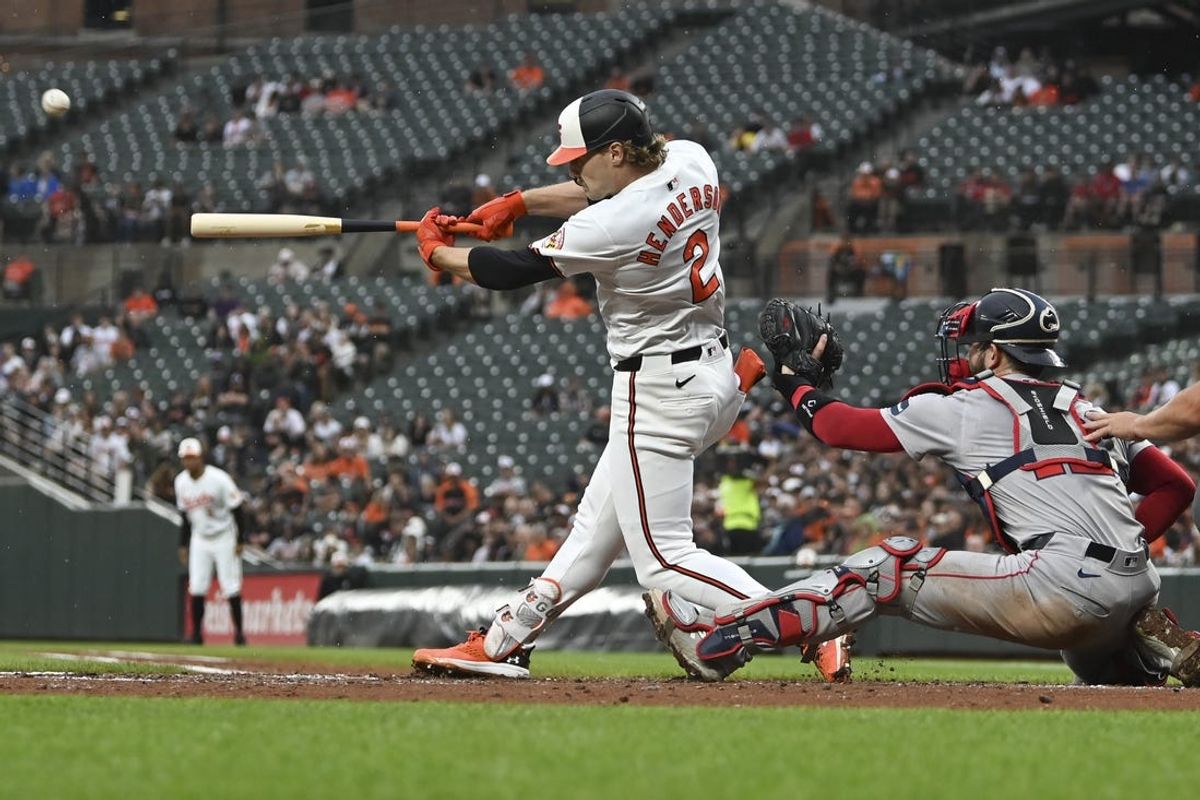 May 29, 2024; Baltimore, Maryland, USA;  Baltimore Orioles shortstop Gunnar Henderson (2) hits a second inning grand slam off Boston Red Sox starting pitcher Kutter Crawford (50) at Oriole Park at Camden Yards. Mandatory Credit: Tommy Gilligan-USA TODAY Sports