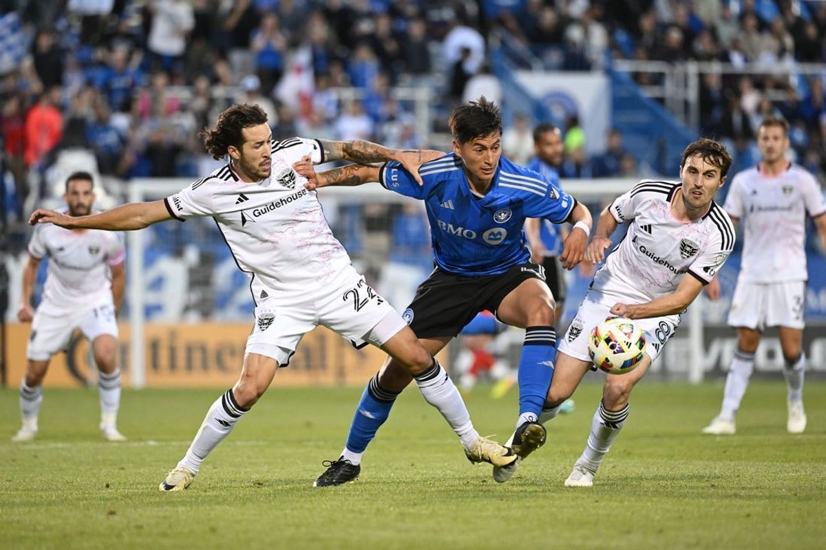 May 29, 2024; Montreal, Quebec, CAN; D.C. United defender Aaron Herrera (22) and D.C. United midfielder Jared Stroud (8) and CF Montreal defender Fernando Alvarez (4) battle for the ball in the first half at Stade Saputo. Mandatory Credit: David Kirouac-USA TODAY Sports