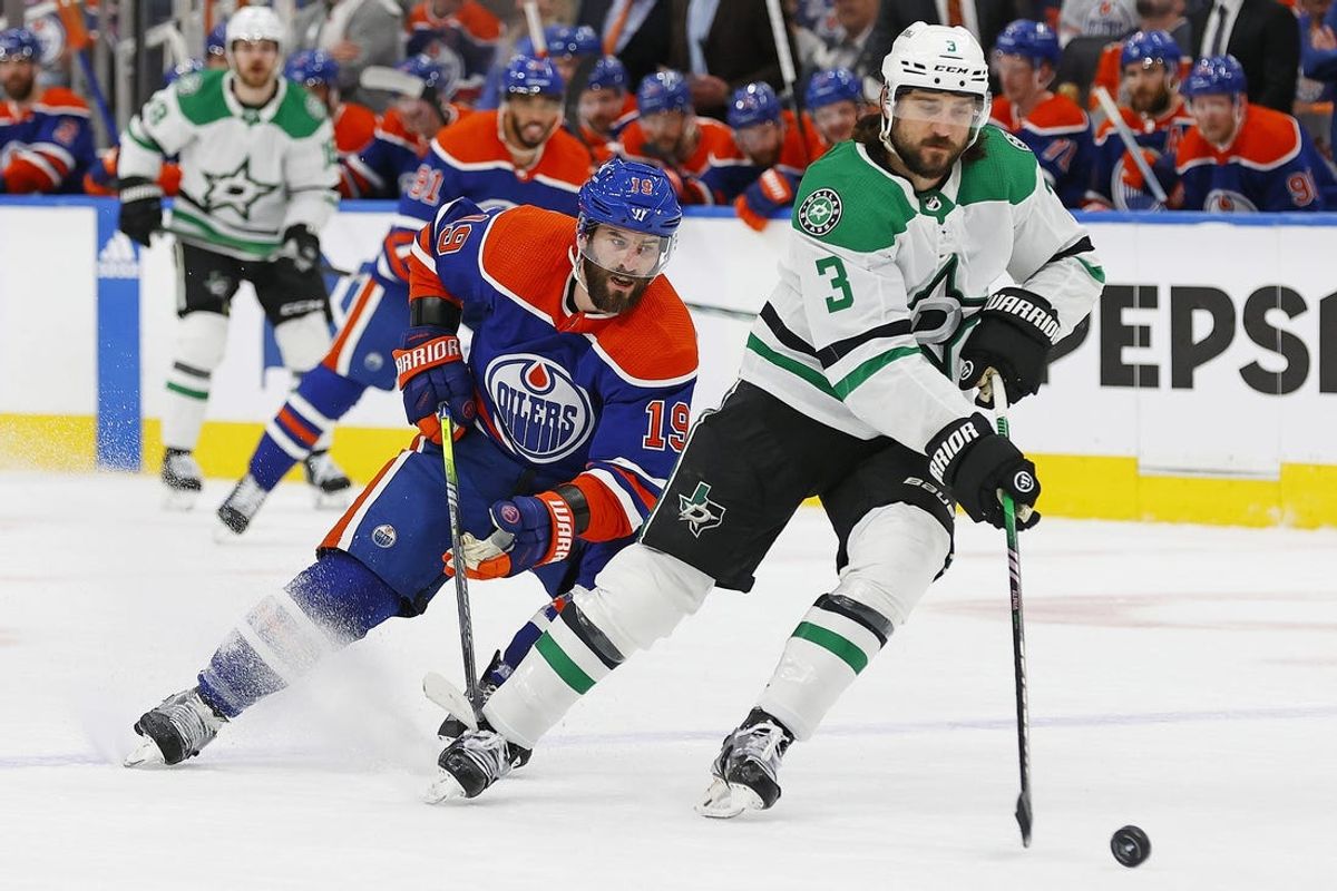 May 29, 2024; Edmonton, Alberta, CAN; Dallas Stars defensemen Chris Tanev (3) protects the puck from Edmonton Oilers forward Adam Henrique (19) during the first period in game four of the Western Conference Final of the 2024 Stanley Cup Playoffs at Rogers Place. Mandatory Credit: Perry Nelson-USA TODAY Sports