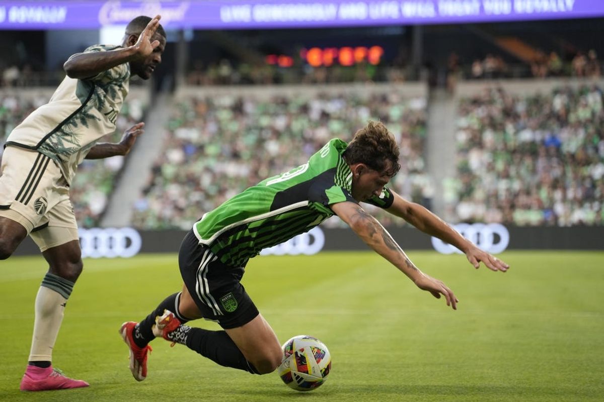 May 29, 2024; Austin, Texas, USA; Austin FC defender Guilherme Biro (29) plays the ball defended by Portland Timbers defender Juan David Mosquera (29) in the first half at Q2 Stadium. Mandatory Credit: Scott Wachter-USA TODAY Sports