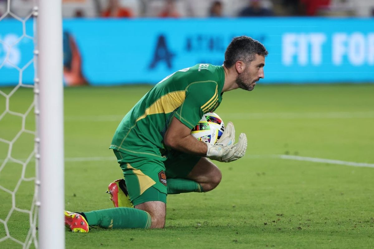 May 29, 2024; Houston, Texas, USA; Houston Dynamo FC goalkeeper Andrew Tarbell (13) makes a save in the second half against the Colorado Rapids at Shell Energy Stadium. Mandatory Credit: Thomas Shea-USA TODAY Sports