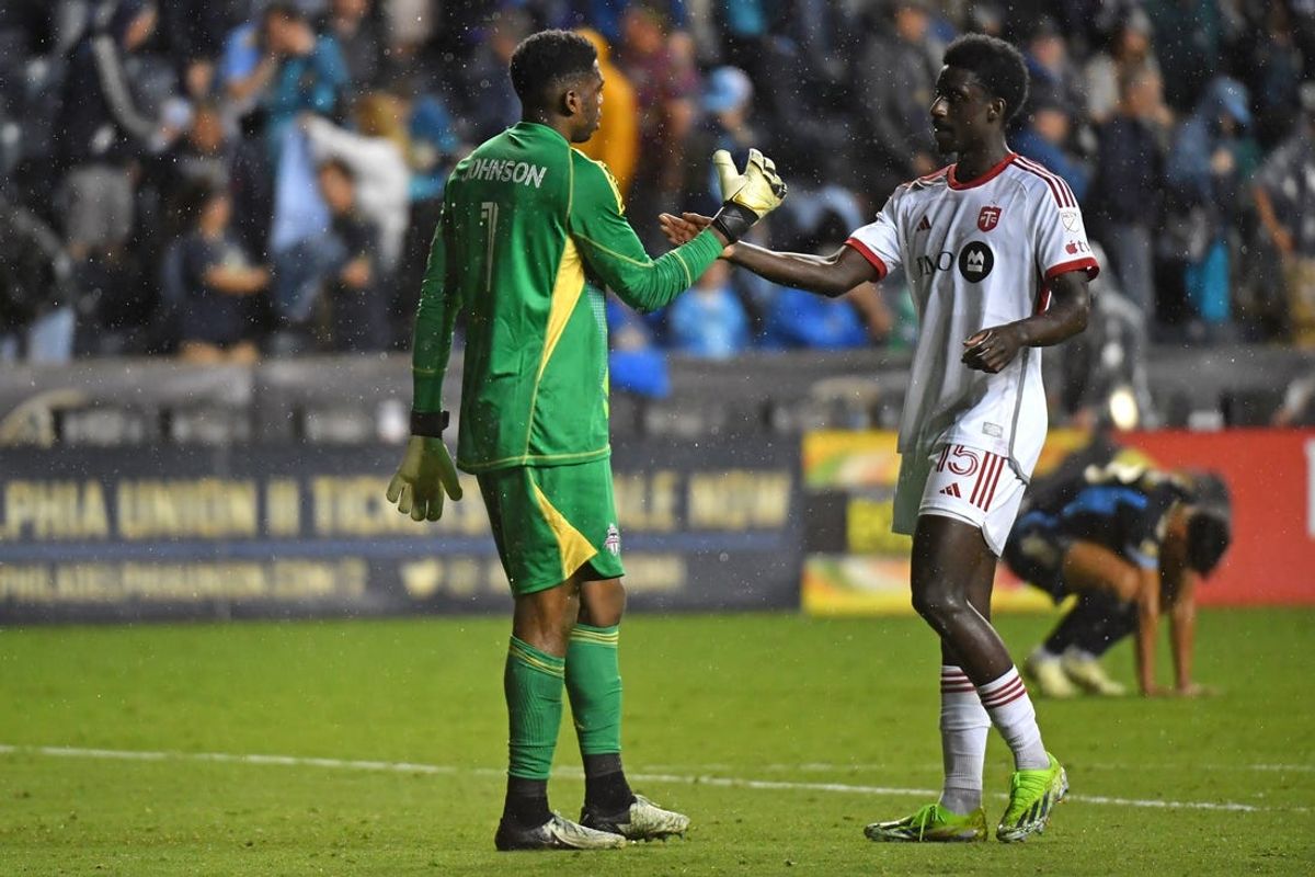 May 29, 2024; Philadelphia, Pennsylvania, USA; Toronto FC goalkeeper Sean Johnson (1) and defender Nicksoen Gomis (15) congratulate each other after tie against the Philadelphia Union at the end of the match at Subaru Park. Mandatory Credit: Eric Hartline-USA TODAY Sports