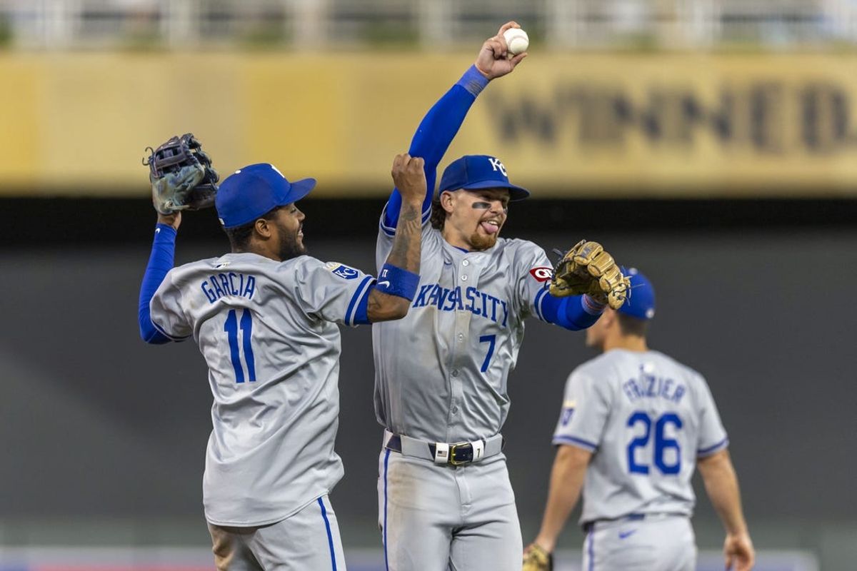 May 29, 2024; Minneapolis, Minnesota, USA; Kansas City Royals shortstop Bobby Witt Jr. (7) and third baseman Maikel Garcia (11) celebrate after defeating the Minnesota Twins at Target Field. Mandatory Credit: Jesse Johnson-USA TODAY Sports