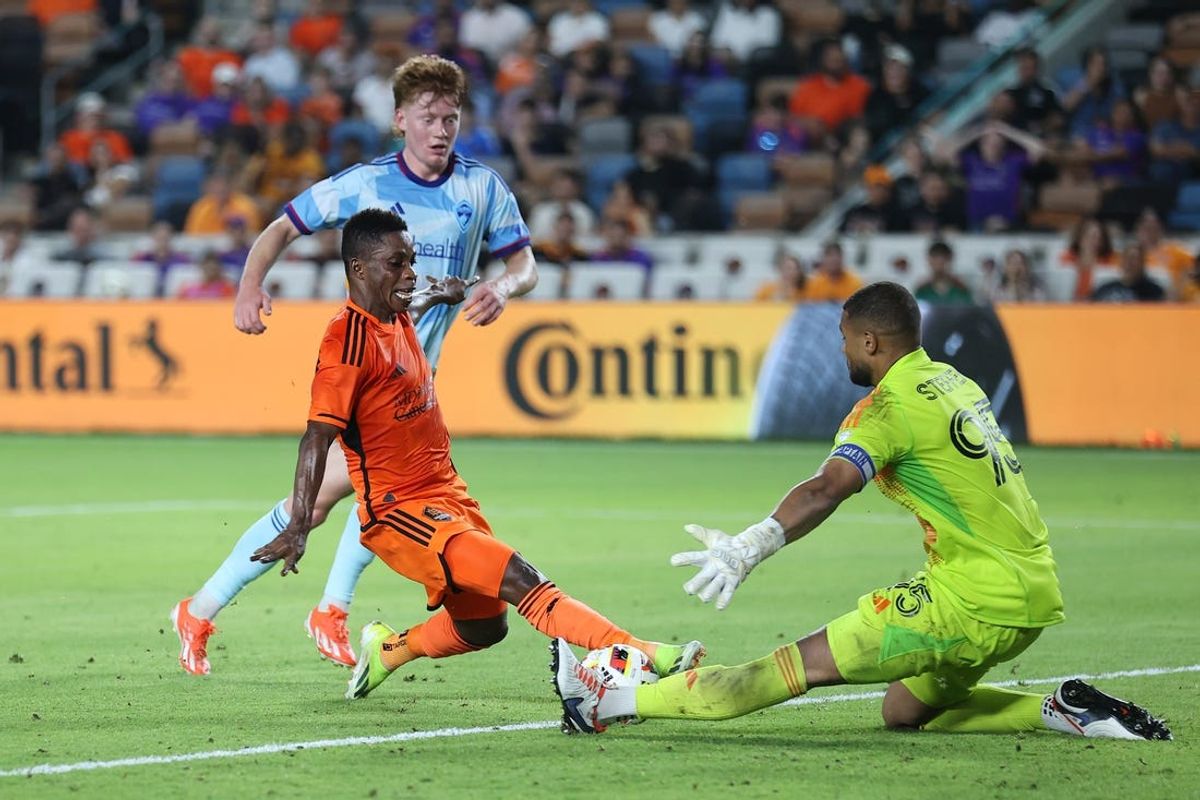 May 29, 2024; Houston, Texas, USA; Houston Dynamo FC midfielder Latif Blessing (15) controls the ball against Colorado Rapids goalkeeper Zack Steffen (95) in the second half at Shell Energy Stadium. Mandatory Credit: Troy Taormina-USA TODAY Sports