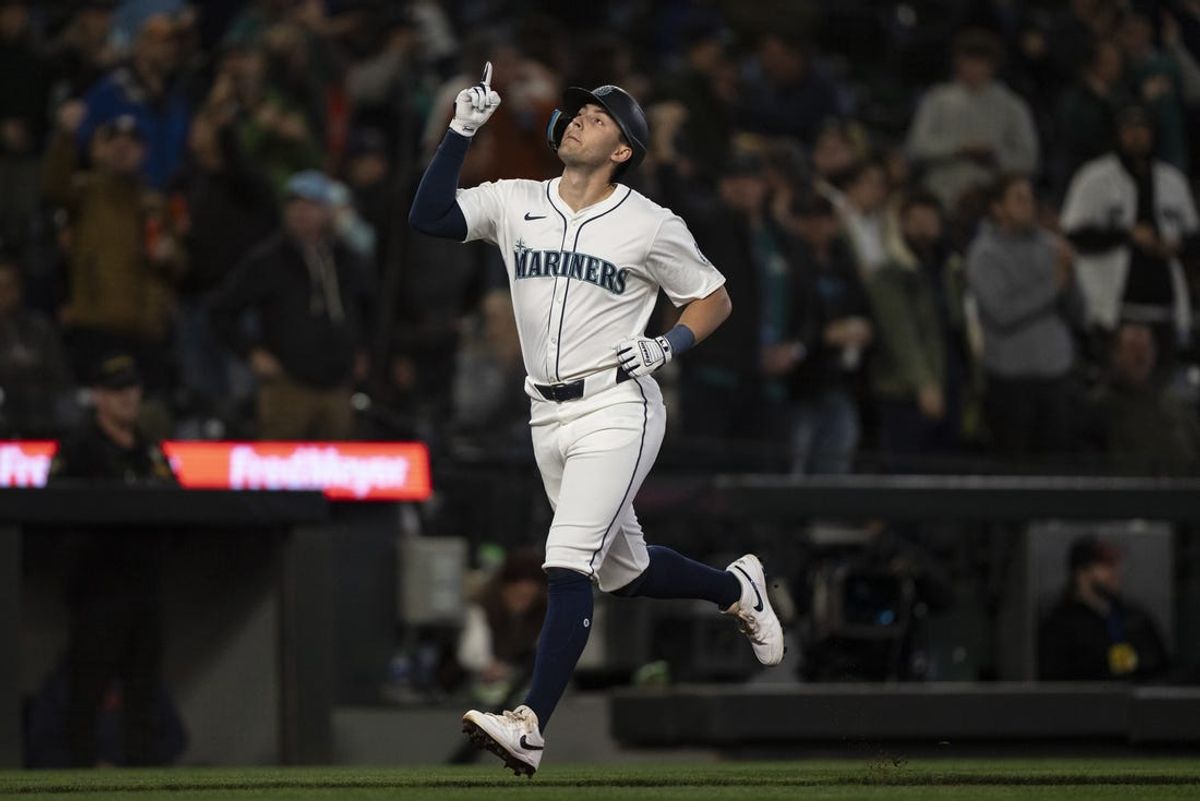 May 29, 2024; Seattle, Washington, USA; Seattle Mariners right fielder Dominic Canzone (8) celebrates after hitting a solo home run during the fifth inning against the Houston Astros at T-Mobile Park. Mandatory Credit: Stephen Brashear-USA TODAY Sports