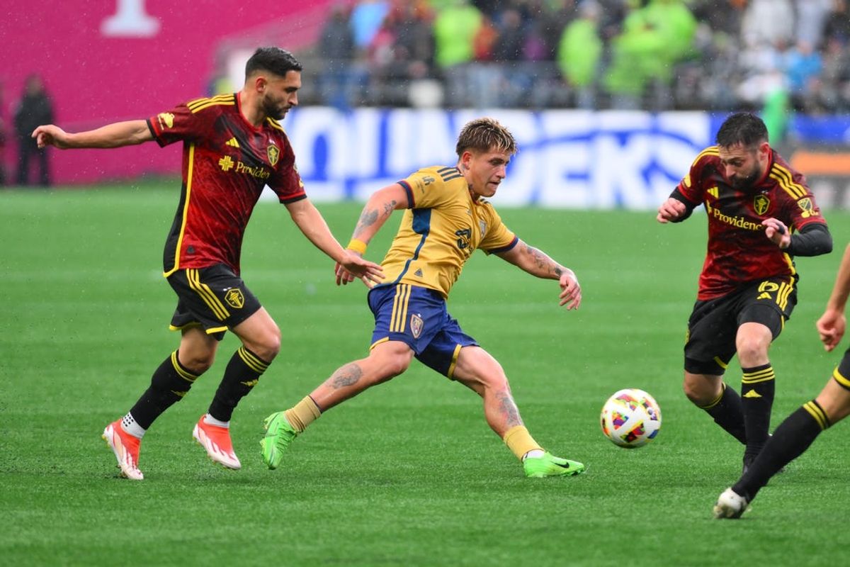 May 29, 2024; Seattle, Washington, USA; Real Salt Lake midfielder Diego Luna (8) plays the ball defended by Seattle Sounders midfielder Cristian Roldan (7) and midfielder Joao Paulo (6) in the first half at Lumen Field. Mandatory Credit: Steven Bisig-USA TODAY Sports