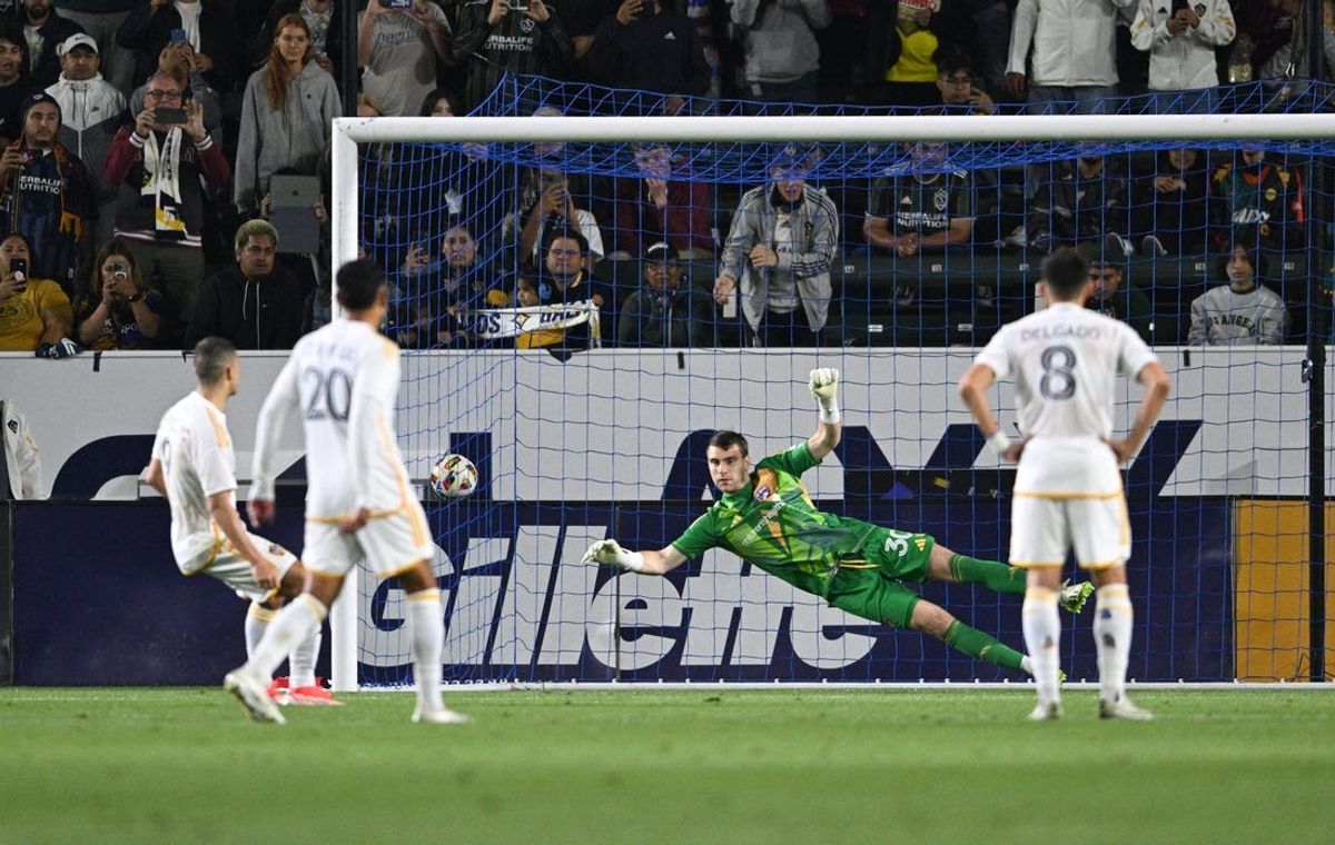 May 29, 2024; Carson, California, USA; LA Galaxy forward Dejan Joveljic (9) scores a goal on a penalty kick past FC Dallas goalkeeper Maarten Paes (30) during the second half at Dignity Health Sports Park. Mandatory Credit: Kelvin Kuo-USA TODAY Sports
