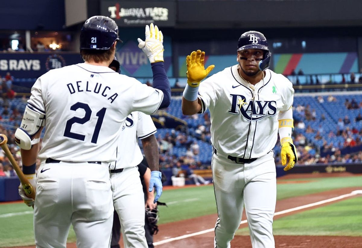 May 30, 2024; St. Petersburg, Florida, USA; Tampa Bay Rays third baseman Isaac Paredes (17) is congratulated by outfielder Jonny DeLuca (21) after hitting a two-run home run against the Oakland Athletics during the first inning at Tropicana Field. Mandatory Credit: Kim Klement Neitzel-USA TODAY Sports