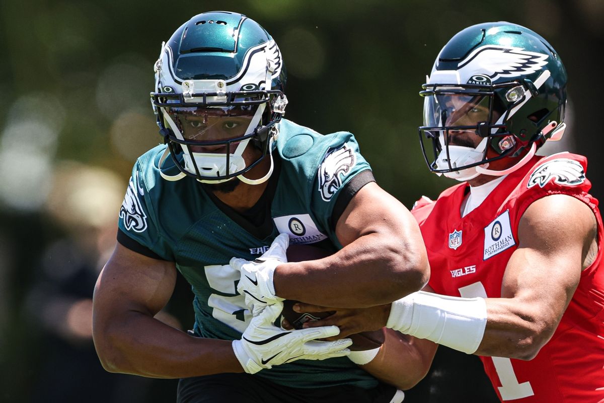 May 30, 2024; Philadelphia, PA, USA; Philadelphia Eagles quarterback Jalen Hurts (1) hands off to running back Saquon Barkley (26) during practice at NovaCare Complex. Mandatory Credit: Bill Streicher-Imagn Images