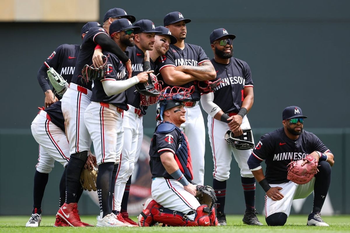 May 30, 2024; Minneapolis, Minnesota, USA; Members of the Minnesota Twins celebrate their teams win against the Kansas City Royals after the game at Target Field. Mandatory Credit: Matt Krohn-USA TODAY Sports