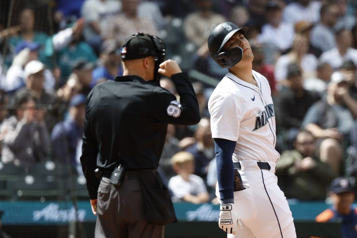 May 30, 2024; Seattle, Washington, USA; Seattle Mariners left fielder Dominic Canzone (8) reacts after striking out against the Houston Astros during the ninth inning at T-Mobile Park. Mandatory Credit: Joe Nicholson-USA TODAY Sports