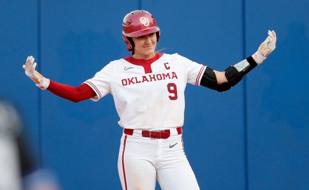 Oklahoma's Kinzie Hansen (9) celebrates a single of the Women's College World Series game between the University of Oklahoma Sooners and Duke at Devon Park in Oklahoma City, Thursday, May, 30, 2024.