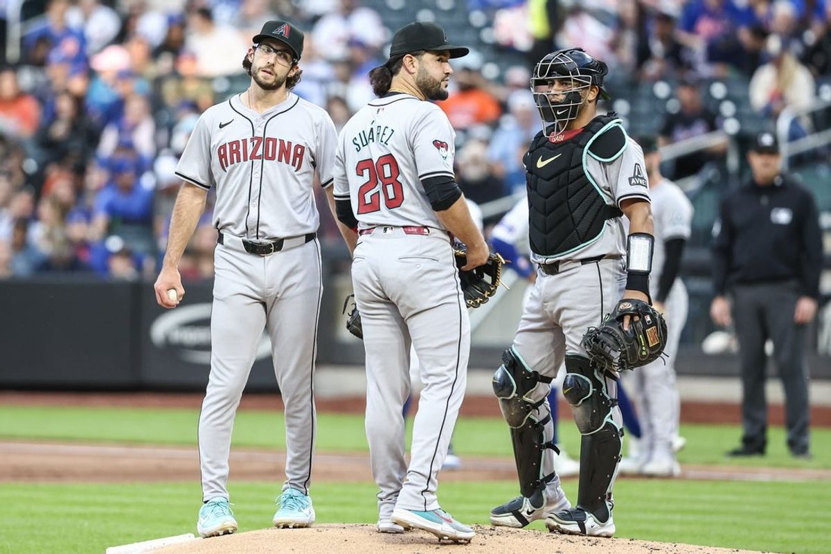 May 30, 2024; New York City, New York, USA; Arizona Diamondbacks starting pitcher Zac Gallen (23) has a meeting on the mound with third baseman Eugenio Suárez (28) and catcher Gabriel Moreno (14) in the first inning against the New York Mets at Citi Field. Mandatory Credit: Wendell Cruz-USA TODAY Sports