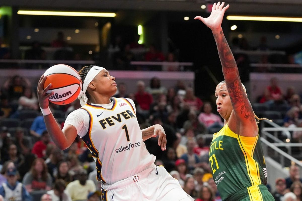 Indiana Fever forward NaLyssa Smith (1) saves the ball from going out of bounds, Thursday, May 30, 2024, during the WNBA game at Gainbridge Fieldhouse in Indianapolis. The Seattle Storm defeated the Indiana Fever 103-88.