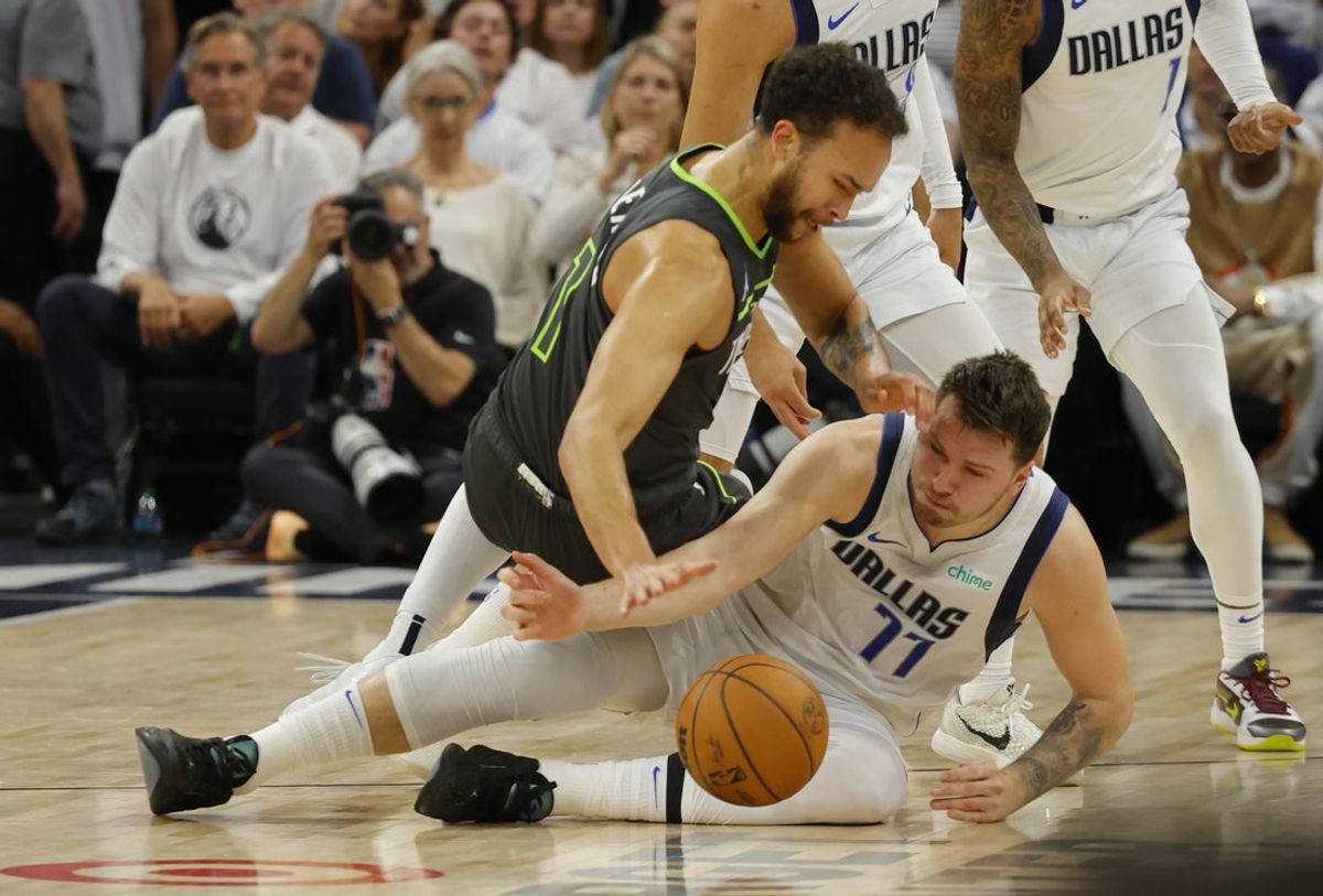 May 30, 2024; Minneapolis, Minnesota, USA; Dallas Mavericks guard Luka Doncic (77) and Minnesota Timberwolves forward Kyle Anderson (1) fight for a loose ball during the second quarter in game five of the western conference finals for the 2024 NBA playoffs at Target Center. Mandatory Credit: Bruce Kluckhohn-Imagn Images