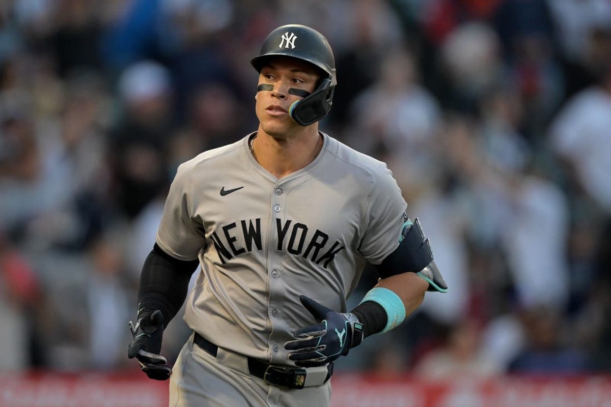 May 30, 2024; Anaheim, California, USA;  New York Yankees center fielder Aaron Judge (99) rounds the bases on a two-run home run scoring right fielder Juan Soto (22) in the fourth inning against the Los Angeles Angels at Angel Stadium. Mandatory Credit: Jayne Kamin-Oncea-USA TODAY Sports
