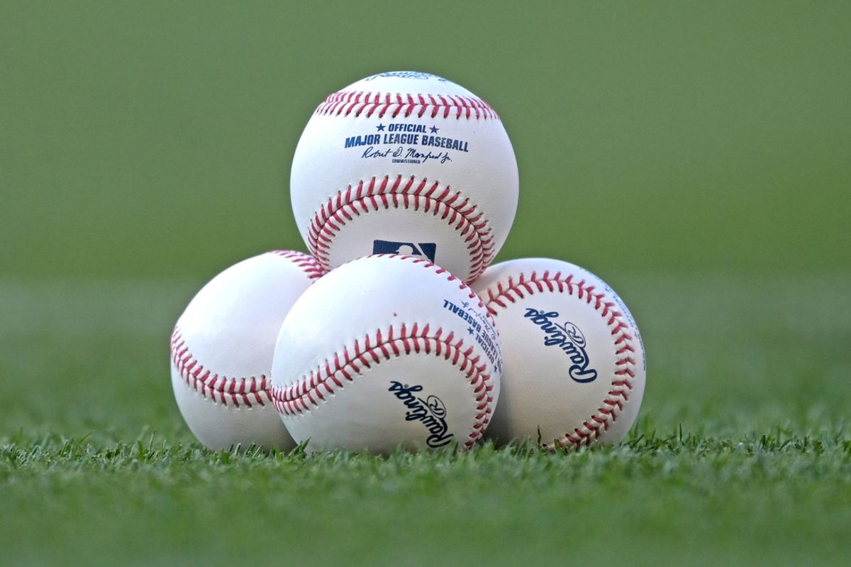 May 30, 2024; Anaheim, California, USA;  Detailed view of major league baseballs stacked on the grass for the game between the Los Angeles Angels and the New York Yankees at Angel Stadium. Mandatory Credit: Jayne Kamin-Oncea-Imagn Images