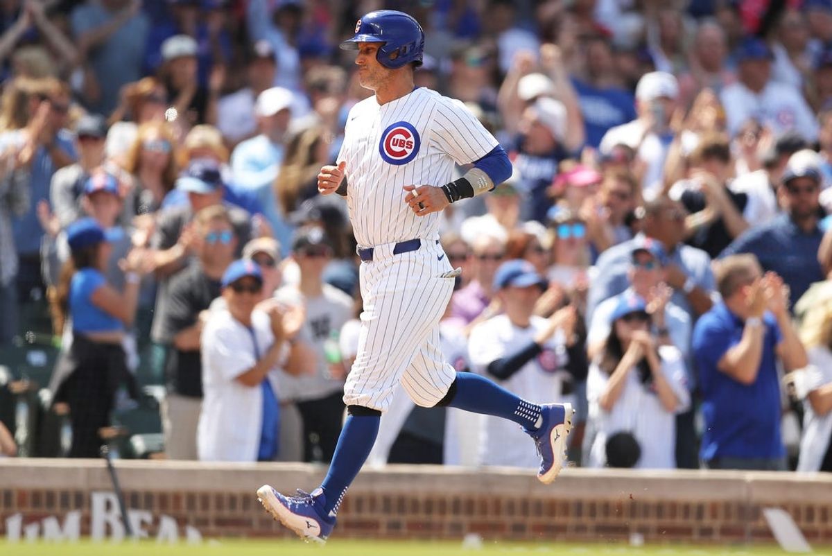 May 31, 2024; Chicago, Illinois, USA; Chicago Cubs catcher Yan Gomes (15) scores on a bases-loaded walk during the fifth inning against the Cincinnati Reds at Wrigley Field. Mandatory Credit: Melissa Tamez-USA TODAY Sports