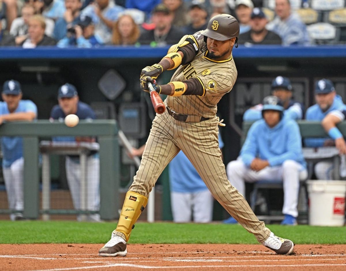 May 31, 2024; Kansas City, Missouri, USA;  San Diego Padres first baseman Luis Arraez (4) singles in the first inning against the Kansas City Royals at Kauffman Stadium. Mandatory Credit: Peter Aiken-USA TODAY Sports